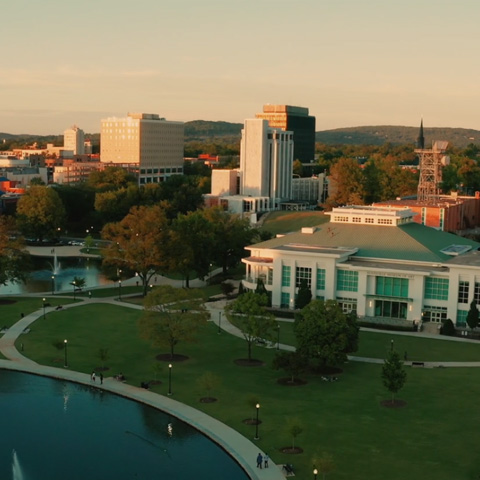 aerial view of buildings and a park